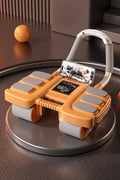 Orange and grey exercise device with smartphone on a brown surface