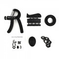 Collection of black hand grip exercises tools on a white background