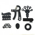Collection of black hand and finger exercisers on a white background